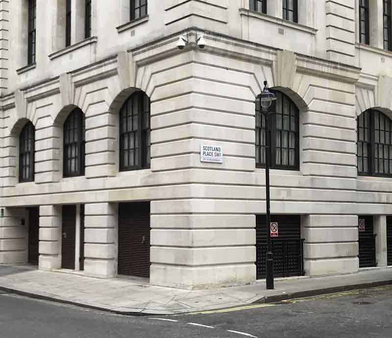 The corner white-stone buildings with Scotland Place.