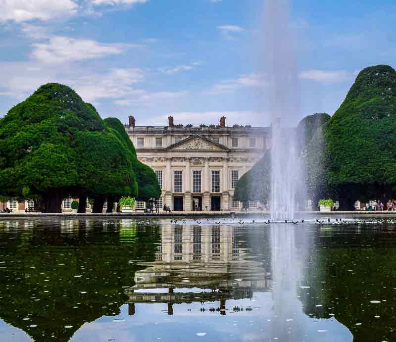 Hampton Court Palace gardens Fountain and ornamental trees.