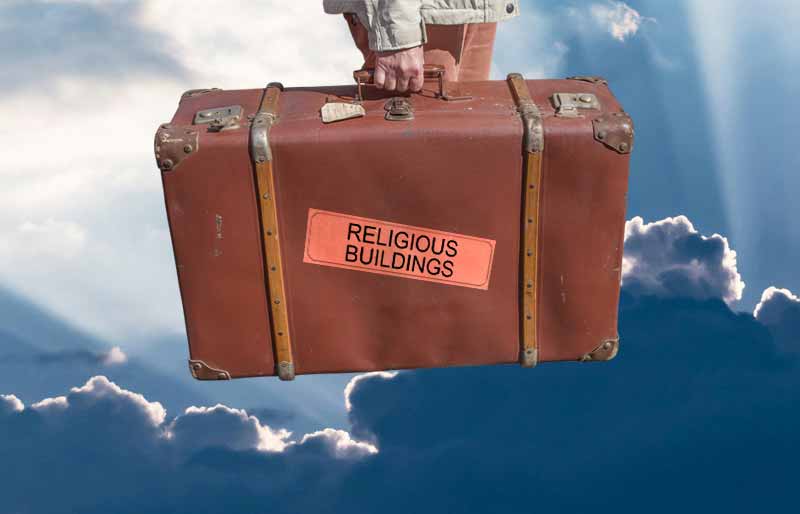 Religious Buildings montage Vintage brown leather suitcase with category travel label on etherial sky background.