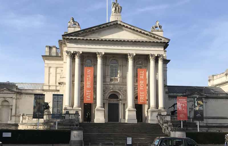 Tate Britain Facade of neoclassical design with a prominent portico, and steps.