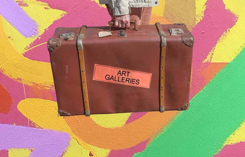 Vintage brown leather suitcase with category travel label on abstract painting background.