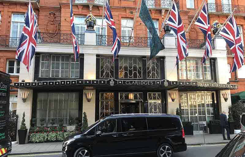 Claridge's The Art Deco styled facade and entrance with Union Flags.