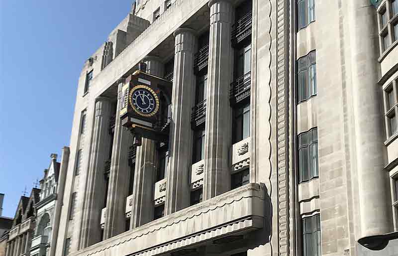Daily Telegraph Building Striking Art Deco columns, carvings and architectural features with clock.