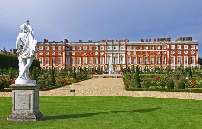 Hampton Court Palace Rear of the Tudor building from the gardens with figural sculpture.
