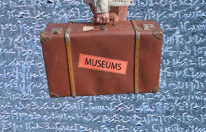 Vintage brown leather suitcase with category travel label on Rosetta Stone background.