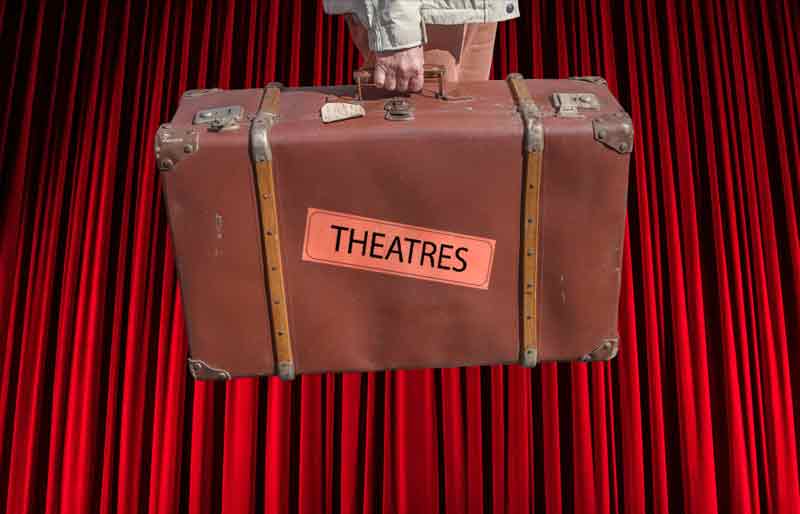 Theatres Vintage brown leather suitcase with category travel label on red curtain background.