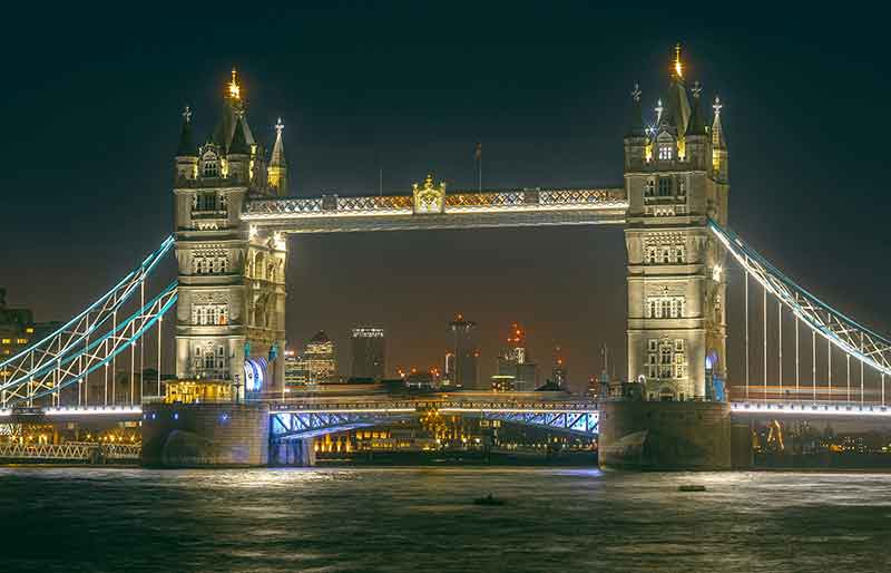 Tower Bridge The Victorian Gothic structure illuminate at night.