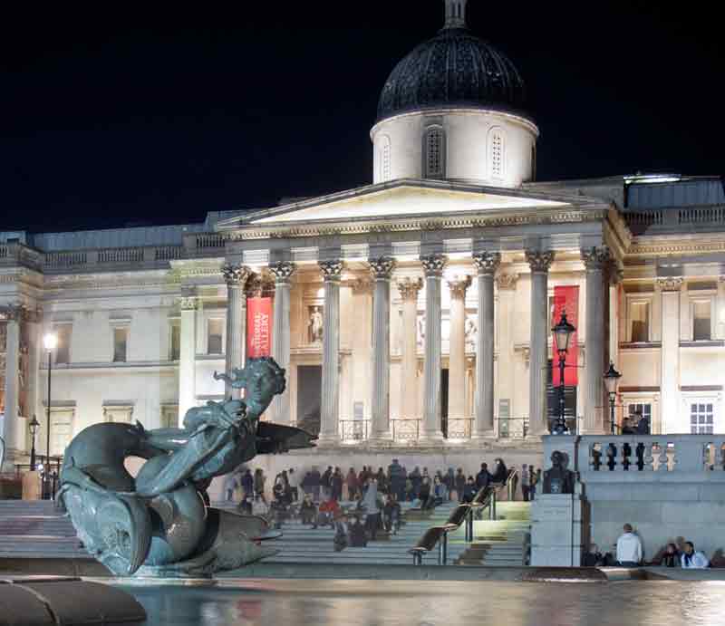 National Gallery at night Illuminated view over a Trafalgar Square fountain.