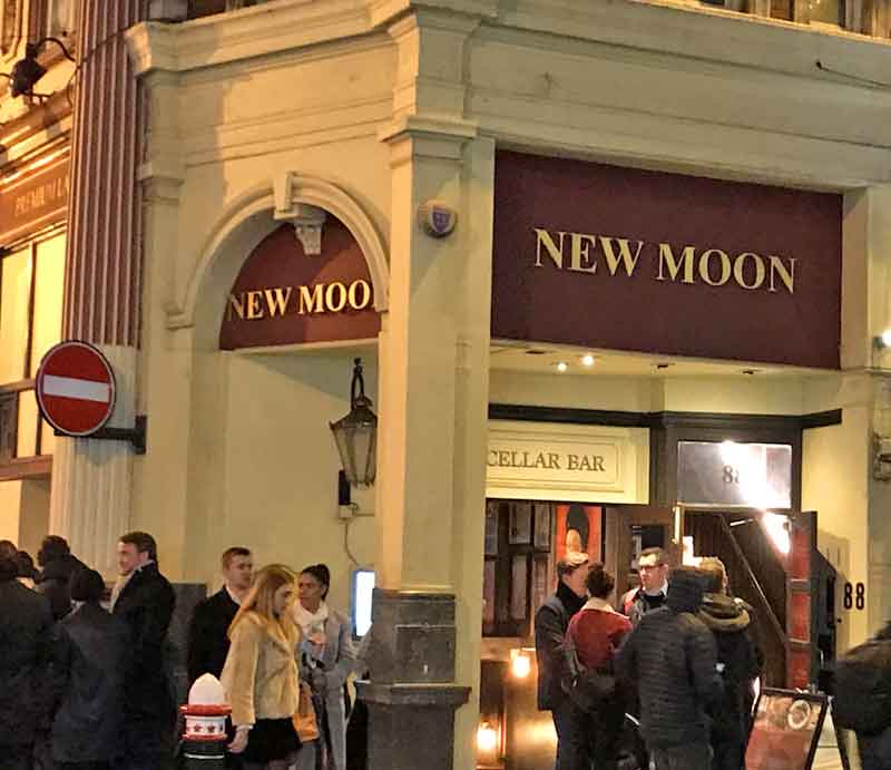 New Moon Exterior of the pub with customers.