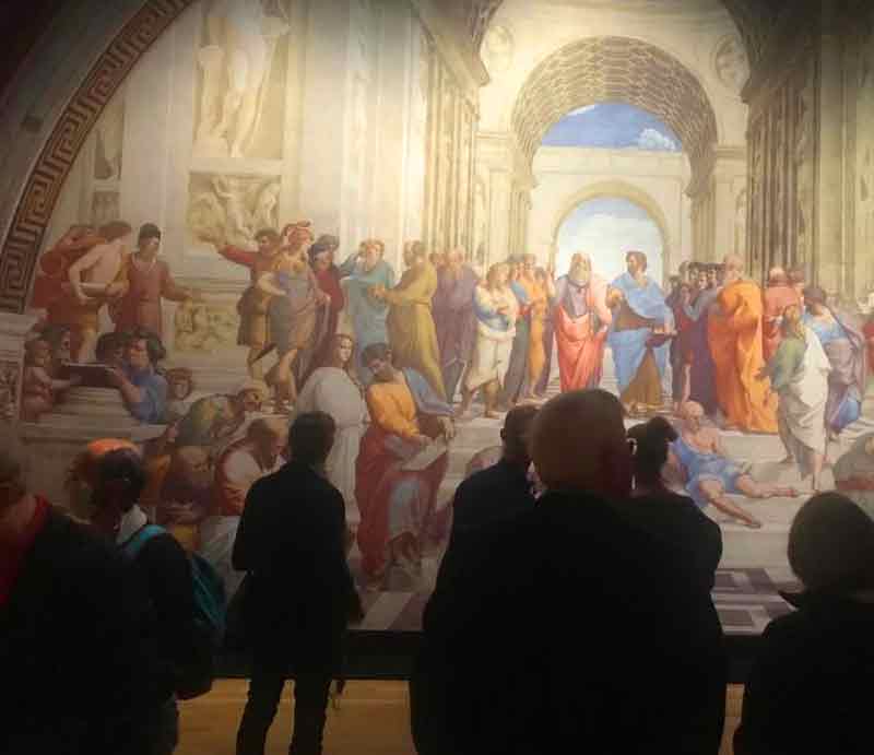 Raphael exhibition Visitors marvelling at a huge work by the artist.