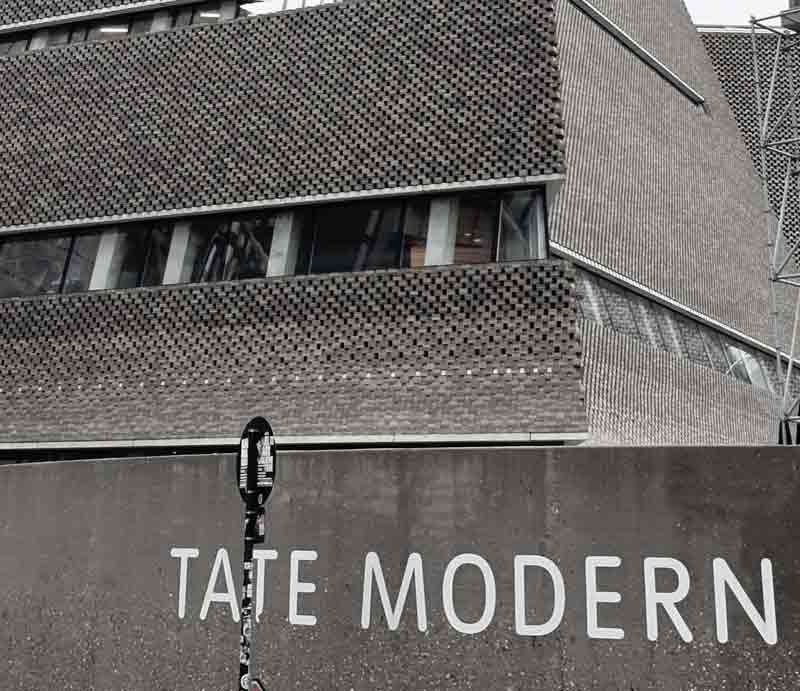 Tate Modern exterior Modernist brickwork and gallery sign.