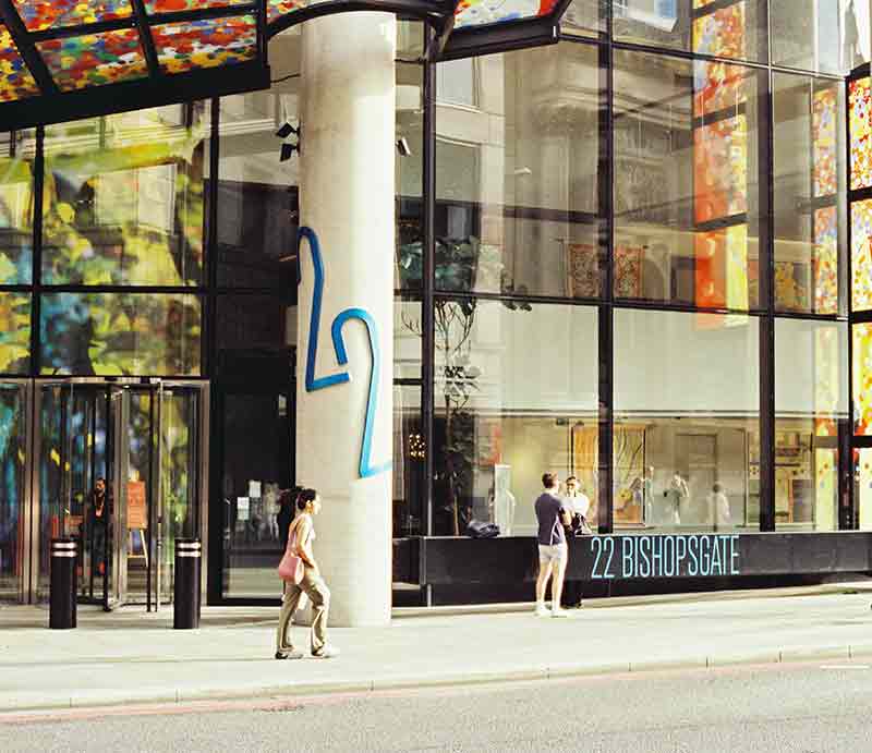 Exterior near entrance showing the building number on a supporting pillar.