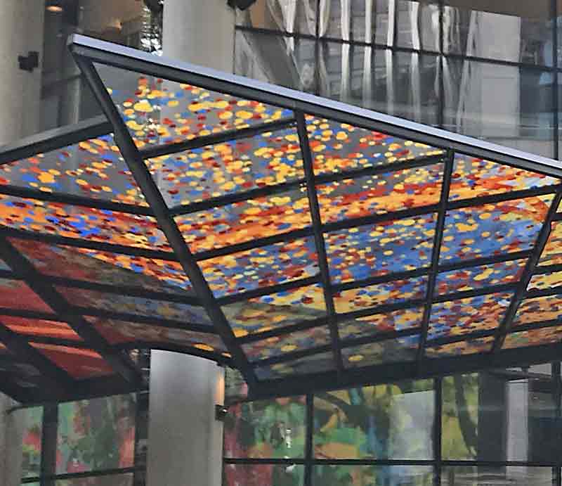 Coloured speckled glass in geometric framework..